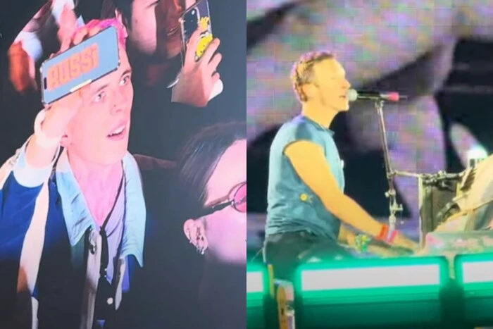 Coldplay виступає на сцені