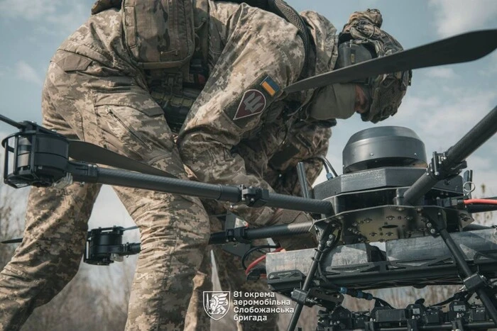In military uniform and with weapons