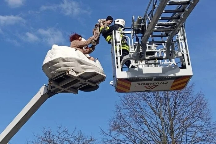 A woman with a child on a ride in Zhytomyr