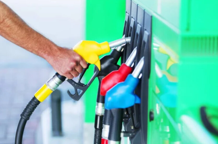 car at a gas station with canisters