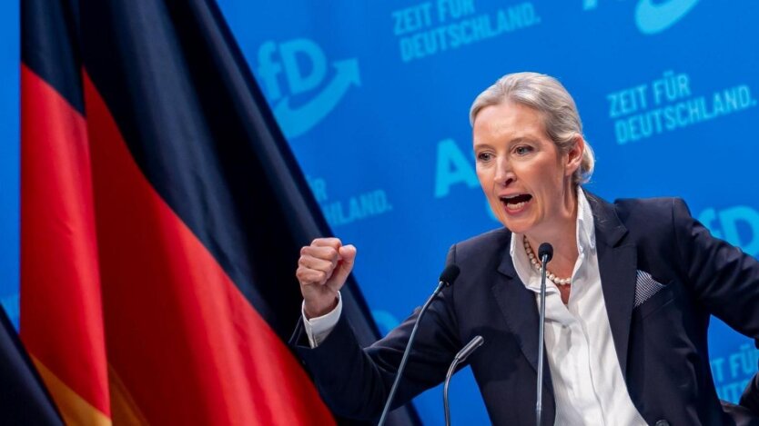 Logo of the 'AfD' party against the backdrop of the German parliament